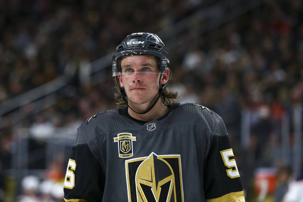 In this image from the Las Vegas Review-Journal, Vegas Golden Knights third line center Erik Haula frowns during a home game as he is donning a dark gray, black, gold and red hockey jersey and helmet that sport his number 56