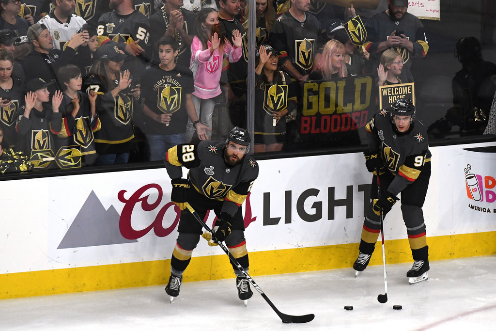 Vegas Golden Knights fourth line players William Carrier and Tomas Nosek line up with pucks during warm-ups for Game 5 of the 2018 Stanley Cup Finals