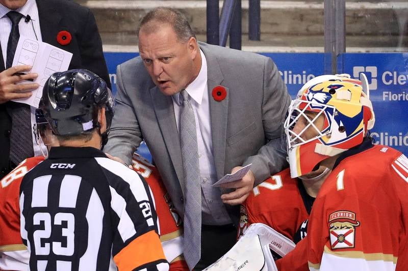 Vegas Golden Knights head coach Gerard Gallant dons a red poppy while speaking to a linesman when he was head coach for the Florida Panthers
